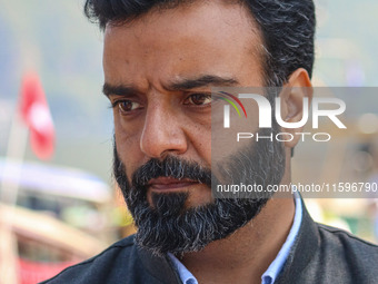 Member of Parliament and National Conference (NC) leader Aga Syed Ruhullah Mehdi looks on during an election rally at Dal Lake, ahead of the...