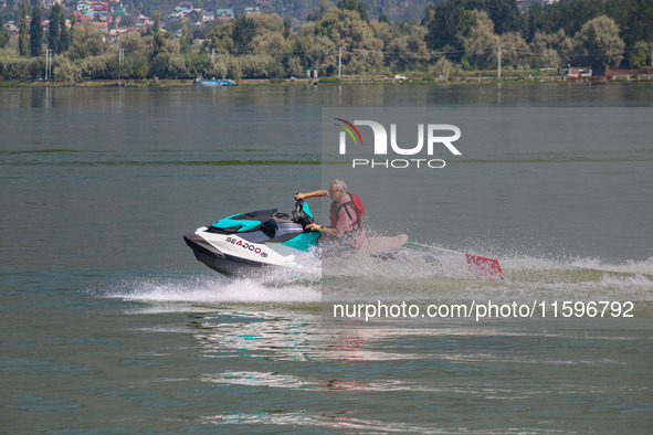 Former chief minister of Jammu and Kashmir and the leader of Jammu and Kashmir National Conference (JKNC) Omar Abdullah rides a jet ski duri...