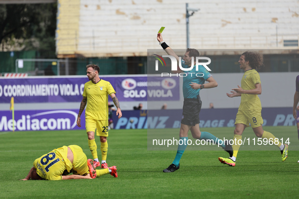 Referee Matteo Marcenaro shows Yellow to Cristiano Biraghi of ACF Fiorentina duringthe Italian Serie A football match between ACF Fiorentina...