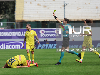 Referee Matteo Marcenaro shows Yellow to Cristiano Biraghi of ACF Fiorentina duringthe Italian Serie A football match between ACF Fiorentina...