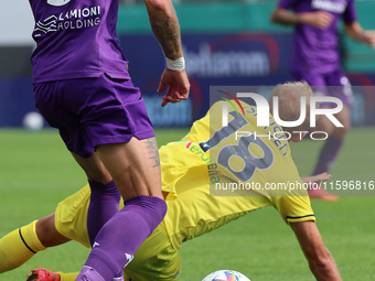 Cristiano Biraghi  of ACF Fiorentina and Gustav Isaksen of SS Lazio ,battle for the ball during the Italian Serie A football match between A...