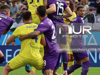 Pietro Comuzzo of ACF Fiorentina and Mario Gila of SS Lazio ,battle for the ball during the Italian Serie A football match between ACF Fiore...