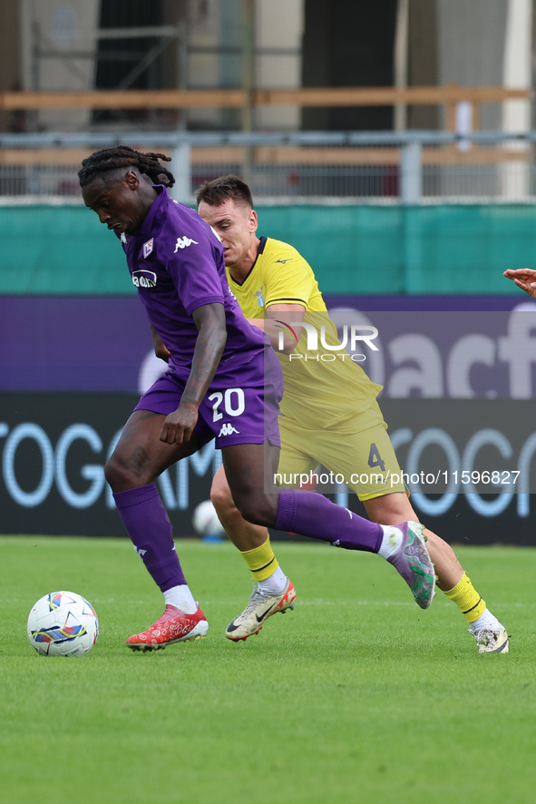 Moise Kean of ACF Fiorentina and Patric of SS Lazio ,battle for the ball during the Italian Serie A football match between ACF Fiorentina an...