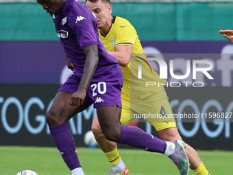 Moise Kean of ACF Fiorentina and Patric of SS Lazio ,battle for the ball during the Italian Serie A football match between ACF Fiorentina an...