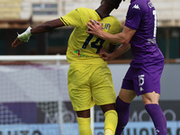 Pietro Comuzzo of ACF Fiorentina and Tijjani Noslin of SS Lazio ,battle for the ball during the Italian Serie A football match between ACF F...