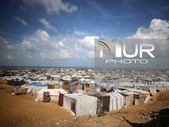 Displaced Palestinians shelter in a tent camp amid the Israel-Hamas conflict in the Al-Mawasi area in Khan Yunis in the southern Gaza Strip...