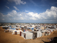 Displaced Palestinians shelter in a tent camp amid the Israel-Hamas conflict in the Al-Mawasi area in Khan Yunis in the southern Gaza Strip...