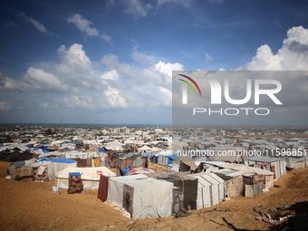 Displaced Palestinians shelter in a tent camp amid the Israel-Hamas conflict in the Al-Mawasi area in Khan Yunis in the southern Gaza Strip...