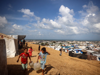 Displaced Palestinians shelter in a tent camp amid the Israel-Hamas conflict in the Al-Mawasi area in Khan Yunis in the southern Gaza Strip...