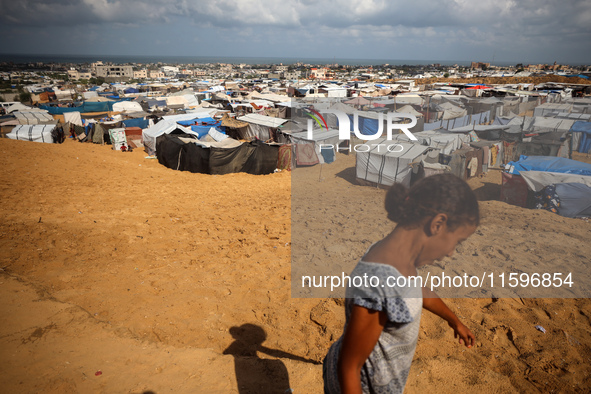 Displaced Palestinians shelter in a tent camp amid the Israel-Hamas conflict in the Al-Mawasi area in Khan Yunis in the southern Gaza Strip...