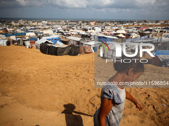 Displaced Palestinians shelter in a tent camp amid the Israel-Hamas conflict in the Al-Mawasi area in Khan Yunis in the southern Gaza Strip...