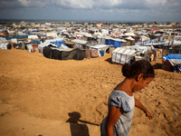 Displaced Palestinians shelter in a tent camp amid the Israel-Hamas conflict in the Al-Mawasi area in Khan Yunis in the southern Gaza Strip...