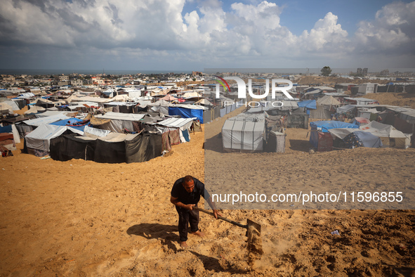 Displaced Palestinians shelter in a tent camp amid the Israel-Hamas conflict in the Al-Mawasi area in Khan Yunis in the southern Gaza Strip...