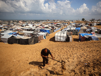 Displaced Palestinians shelter in a tent camp amid the Israel-Hamas conflict in the Al-Mawasi area in Khan Yunis in the southern Gaza Strip...