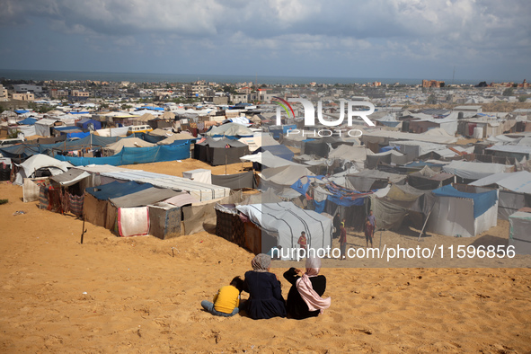 Displaced Palestinians shelter in a tent camp amid the Israel-Hamas conflict in the Al-Mawasi area in Khan Yunis in the southern Gaza Strip...