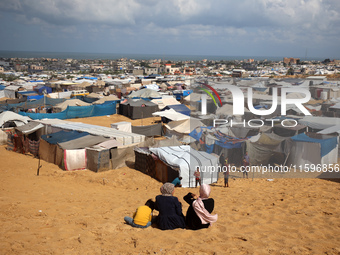 Displaced Palestinians shelter in a tent camp amid the Israel-Hamas conflict in the Al-Mawasi area in Khan Yunis in the southern Gaza Strip...