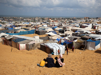 Displaced Palestinians shelter in a tent camp amid the Israel-Hamas conflict in the Al-Mawasi area in Khan Yunis in the southern Gaza Strip...