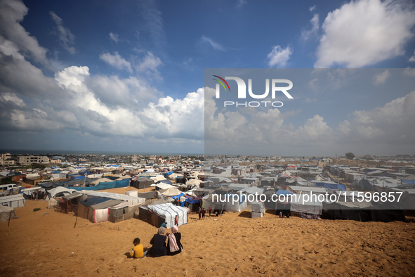 Displaced Palestinians shelter in a tent camp amid the Israel-Hamas conflict in the Al-Mawasi area in Khan Yunis in the southern Gaza Strip...