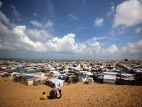 Displaced Palestinians shelter in a tent camp amid the Israel-Hamas conflict in the Al-Mawasi area in Khan Yunis in the southern Gaza Strip...