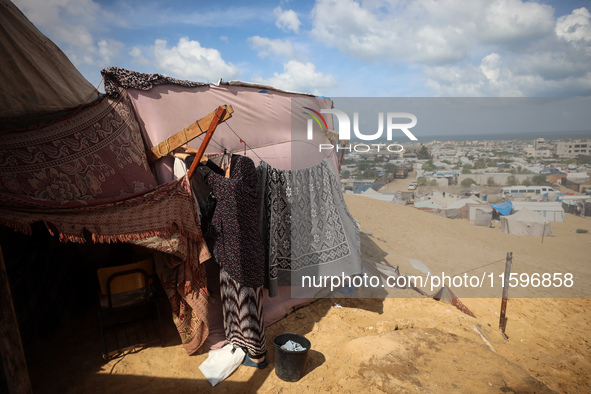 Displaced Palestinians shelter in a tent camp amid the Israel-Hamas conflict in the Al-Mawasi area in Khan Yunis in the southern Gaza Strip...