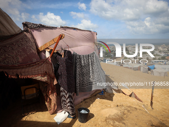 Displaced Palestinians shelter in a tent camp amid the Israel-Hamas conflict in the Al-Mawasi area in Khan Yunis in the southern Gaza Strip...