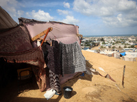 Displaced Palestinians shelter in a tent camp amid the Israel-Hamas conflict in the Al-Mawasi area in Khan Yunis in the southern Gaza Strip...