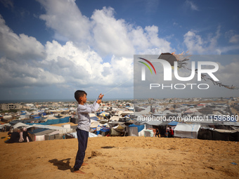 Displaced Palestinians shelter in a tent camp amid the Israel-Hamas conflict in the Al-Mawasi area in Khan Yunis in the southern Gaza Strip...