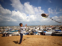 Displaced Palestinians shelter in a tent camp amid the Israel-Hamas conflict in the Al-Mawasi area in Khan Yunis in the southern Gaza Strip...