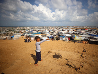 Displaced Palestinians shelter in a tent camp amid the Israel-Hamas conflict in the Al-Mawasi area in Khan Yunis in the southern Gaza Strip...