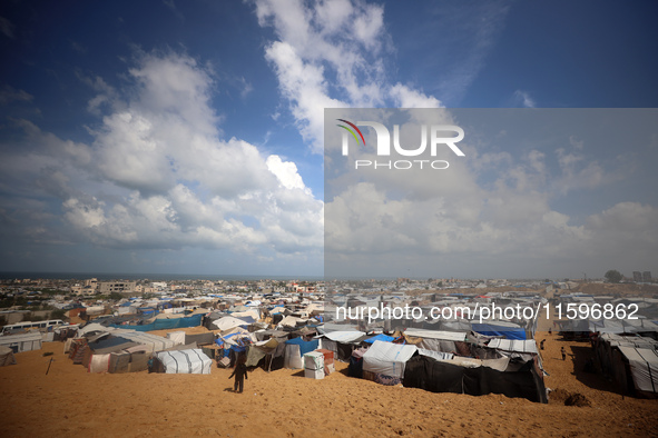 Displaced Palestinians shelter in a tent camp amid the Israel-Hamas conflict in the Al-Mawasi area in Khan Yunis in the southern Gaza Strip...