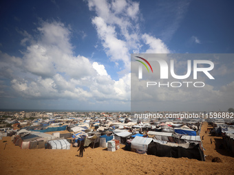 Displaced Palestinians shelter in a tent camp amid the Israel-Hamas conflict in the Al-Mawasi area in Khan Yunis in the southern Gaza Strip...