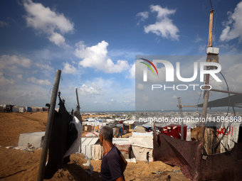 Displaced Palestinians shelter in a tent camp amid the Israel-Hamas conflict in the Al-Mawasi area in Khan Yunis in the southern Gaza Strip...