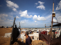 Displaced Palestinians shelter in a tent camp amid the Israel-Hamas conflict in the Al-Mawasi area in Khan Yunis in the southern Gaza Strip...