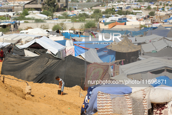 Displaced Palestinians shelter in a tent camp amid the Israel-Hamas conflict in the Al-Mawasi area in Khan Yunis in the southern Gaza Strip...