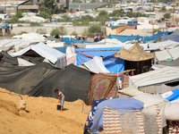 Displaced Palestinians shelter in a tent camp amid the Israel-Hamas conflict in the Al-Mawasi area in Khan Yunis in the southern Gaza Strip...