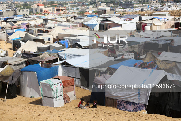 Displaced Palestinians shelter in a tent camp amid the Israel-Hamas conflict in the Al-Mawasi area in Khan Yunis in the southern Gaza Strip...