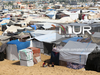 Displaced Palestinians shelter in a tent camp amid the Israel-Hamas conflict in the Al-Mawasi area in Khan Yunis in the southern Gaza Strip...