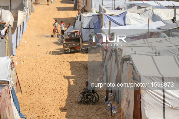 Displaced Palestinians shelter in a tent camp amid the Israel-Hamas conflict in the Al-Mawasi area in Khan Yunis in the southern Gaza Strip...