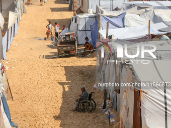 Displaced Palestinians shelter in a tent camp amid the Israel-Hamas conflict in the Al-Mawasi area in Khan Yunis in the southern Gaza Strip...