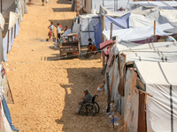 Displaced Palestinians shelter in a tent camp amid the Israel-Hamas conflict in the Al-Mawasi area in Khan Yunis in the southern Gaza Strip...