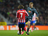 Arthur Vermeeren central midfield of RB Leipzig and Belgium and Antoine Griezmann second striker of Atletico de Madrid and France compete fo...