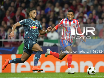 Benjamin Henrichs right-back of RB Leipzig and Germany and Samuel Lino left winger of Atletico de Madrid and Brazil compete for the ball dur...