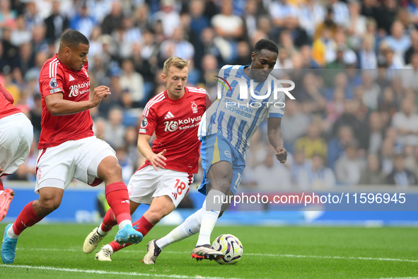 Danny Welbeck of Brighton is under pressure from James Ward-Prowse and Murillo of Nottingham Forest during the Premier League match between...