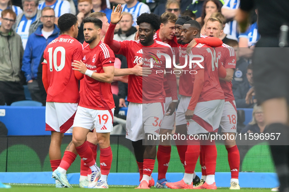 The Reds celebrate after Chris Wood of Nottingham Forest scores from the penalty spot to make it 0-1 during the Premier League match between...