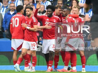 The Reds celebrate after Chris Wood of Nottingham Forest scores from the penalty spot to make it 0-1 during the Premier League match between...