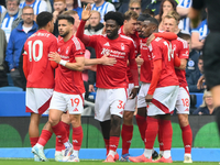 The Reds celebrate after Chris Wood of Nottingham Forest scores from the penalty spot to make it 0-1 during the Premier League match between...