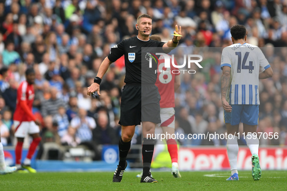 Referee Robert Jones gestures during the Premier League match between Brighton and Hove Albion and Nottingham Forest at the American Express...