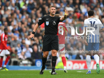 Referee Robert Jones gestures during the Premier League match between Brighton and Hove Albion and Nottingham Forest at the American Express...