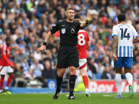 Referee Robert Jones gestures during the Premier League match between Brighton and Hove Albion and Nottingham Forest at the American Express...