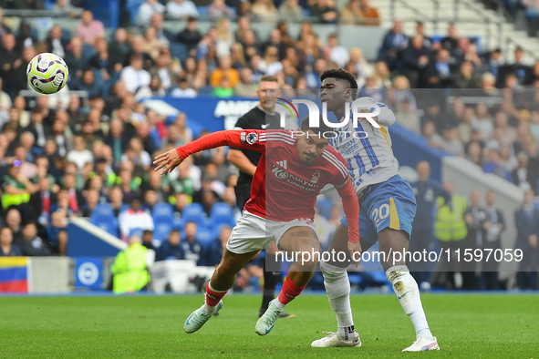 Morgan Gibbs-White of Nottingham Forest battles with Carlos Baleba of Brighton during the Premier League match between Brighton and Hove Alb...